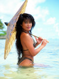 Woman in Bikini Holding Parasol