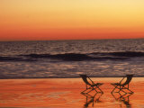Silhouette of Two Chairs on the Beach