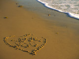 Heart and "Love You" Carved Into Beach Sand with Tid