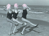 Three Women on Beach with Pink Towels on Head