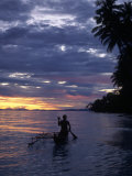 Native Fisherman in Outrigger Canoe  Indonesia