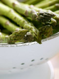 Asparagus  Washed Green Asparagus Spears in a Colander