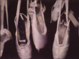 Worn Ballet Shoes Hanging in a Window
