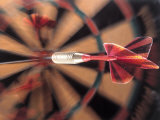 Dart in Bull's Eye on Dart Board