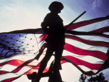 Silhouette of Soldier in Front of Flag