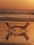 Silhouette of Woman in Beach Chair on the Beach