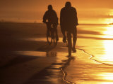 Couple Biking Toward Sunset  Monterey  CA