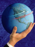 Businessman's Hand Holding Globe