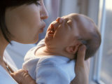 Mother Kissing Infant