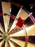Dart in Bull's Eye of Dart Board