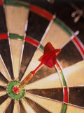 Dart in Bull's Eye of Dart Board