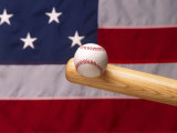 Bat Hitting Baseball Against Flag