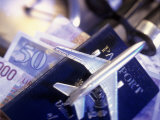 Model Jet Over US Passport and Foreign Currencies