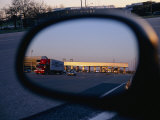 A Rearview Mirror Reflects a Busy Tollgate on the New Jersey Turnpike