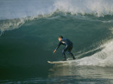 A Surfer Rides a Wave