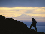 Silhouette of Hiker Ascending Flat Top Mountain at Sunset