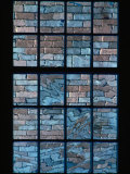 A Window Looks out Upon a Colorful Brick Wall