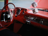 Fuzzy Dice and Cherry Red Interior of a Classic Car