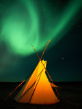 A Solitary Tepee is Illuminated by the Aurora Borealis