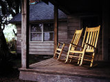 Seaside Cottage with a Pair of Rocking Chairs on its Porch