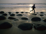 Jogger on a Stony Beach