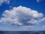 White  Fluffy Clouds Form Above the Water at Twofold Bay in Australia
