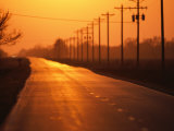 A Country Highway Fades into the Sunset Near Wood River  Nebraska