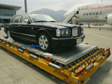 Luxury Bentley Unloaded from an Airplane at Chek Lap Kok Airport
