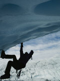 A Man Climbs out of an Ice Cave