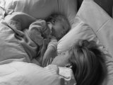 A Mother and Her Baby Boy Take a Nap Together