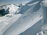 A Man Skiing the Dogtooth Range