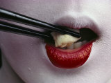 Close View of a Geisha Eating Tofu with Chopsticks