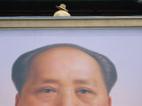 A Person Stands on a Balcony over a Giant Poster of Mao Tse-Tung