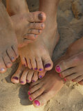 Cluster of Bare Feet with Painted Toenails