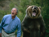 A Man and a Trained Grizzly Bear Snarl for the Camera