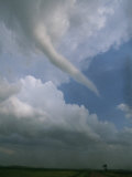 A Funnel Cloud Reaches Towards Earth from the Sky