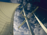 Upward View of a Sailboat with the Mainsail Full of Wind