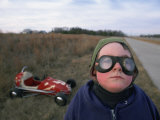 A Boy  Dressed to Travel  Stands in Front of His "Midget Racer"