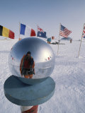 Flags of Many Nations and a Ceremonial Globe at the South Pole