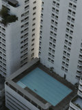 An Interesting View Looking Down the Side of Two High- Rise Buildings