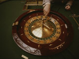 A Patron Spins a Roulette Wheel at a Casino in Monaco