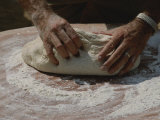 Close View of Hands Kneading Bread