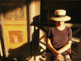 A Portrait of a Woman Sitting in the Shadows
