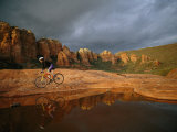 A Biker Cycles Across the Desert