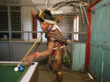 A Huli Wigman Plays Pool in a Pub During the Annual Sing-Sing in Goroka