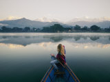 A Woman Stares at the Distant Annapurna Range from a Rowboat