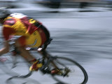 A Bicyclist Speeds Past in a Race