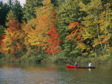Father and Son Fish from a Canoe Amid the Autumn Foliage