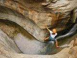A Climber Climbs up the Corner of a Cliff