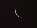 Sliver of the Moon during the New Moon Phase in Dark Black Sky